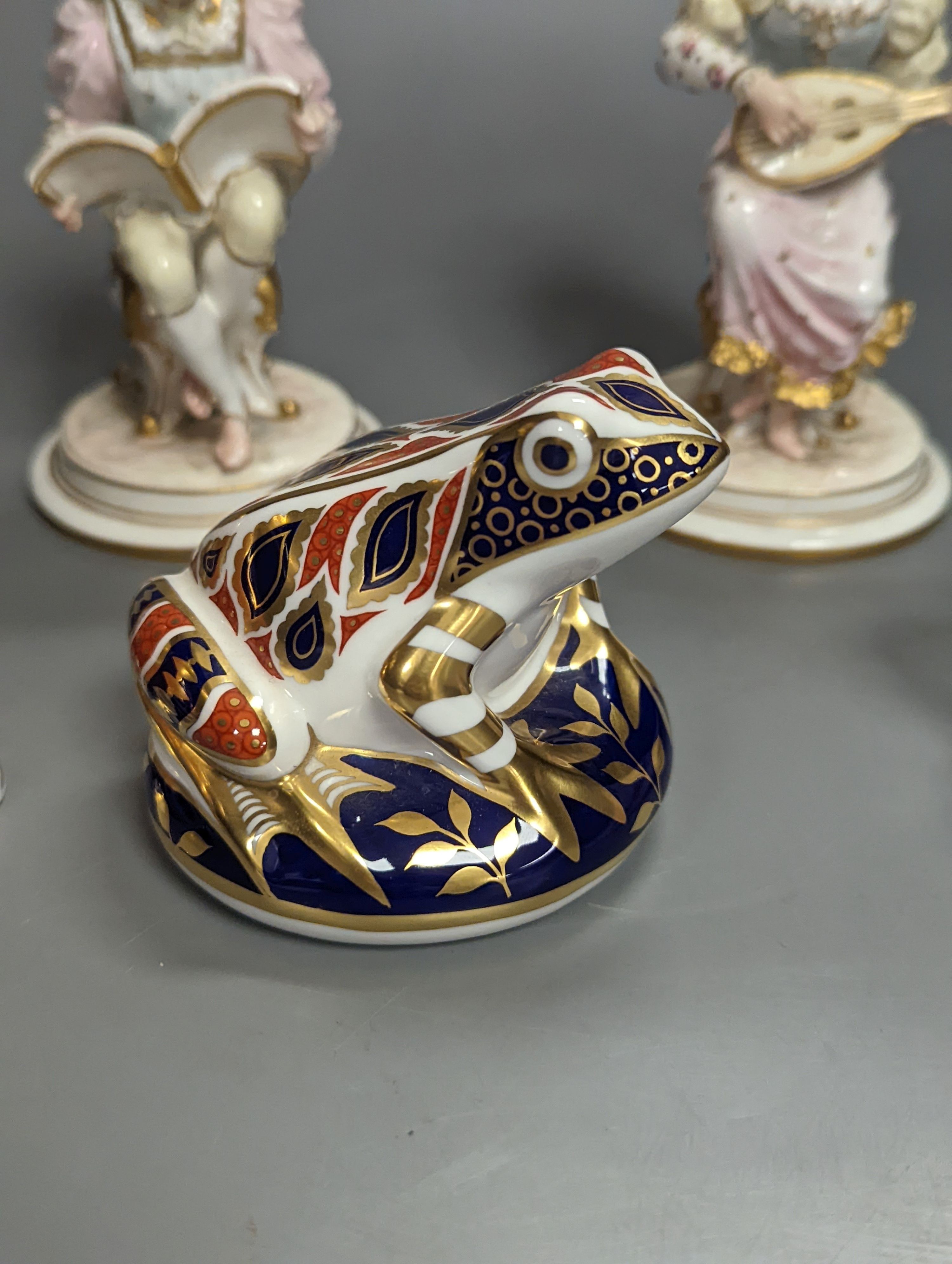 A pair of Royal Crown Derby figures of musicians, c.1905, 15cm, two similar animal paperweights and a Latticino glass slipper, tallest being the dragon 11cm
